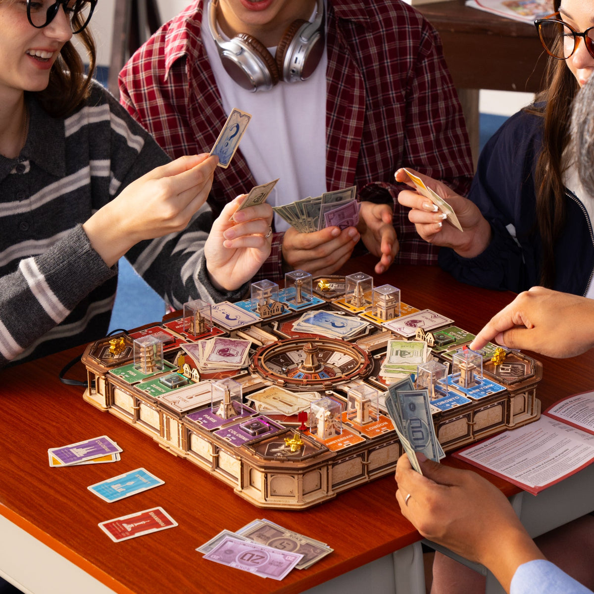 Friends playing the completed ROKR Fortune Quest board game